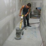 grinding back the concrete to reveal paletts